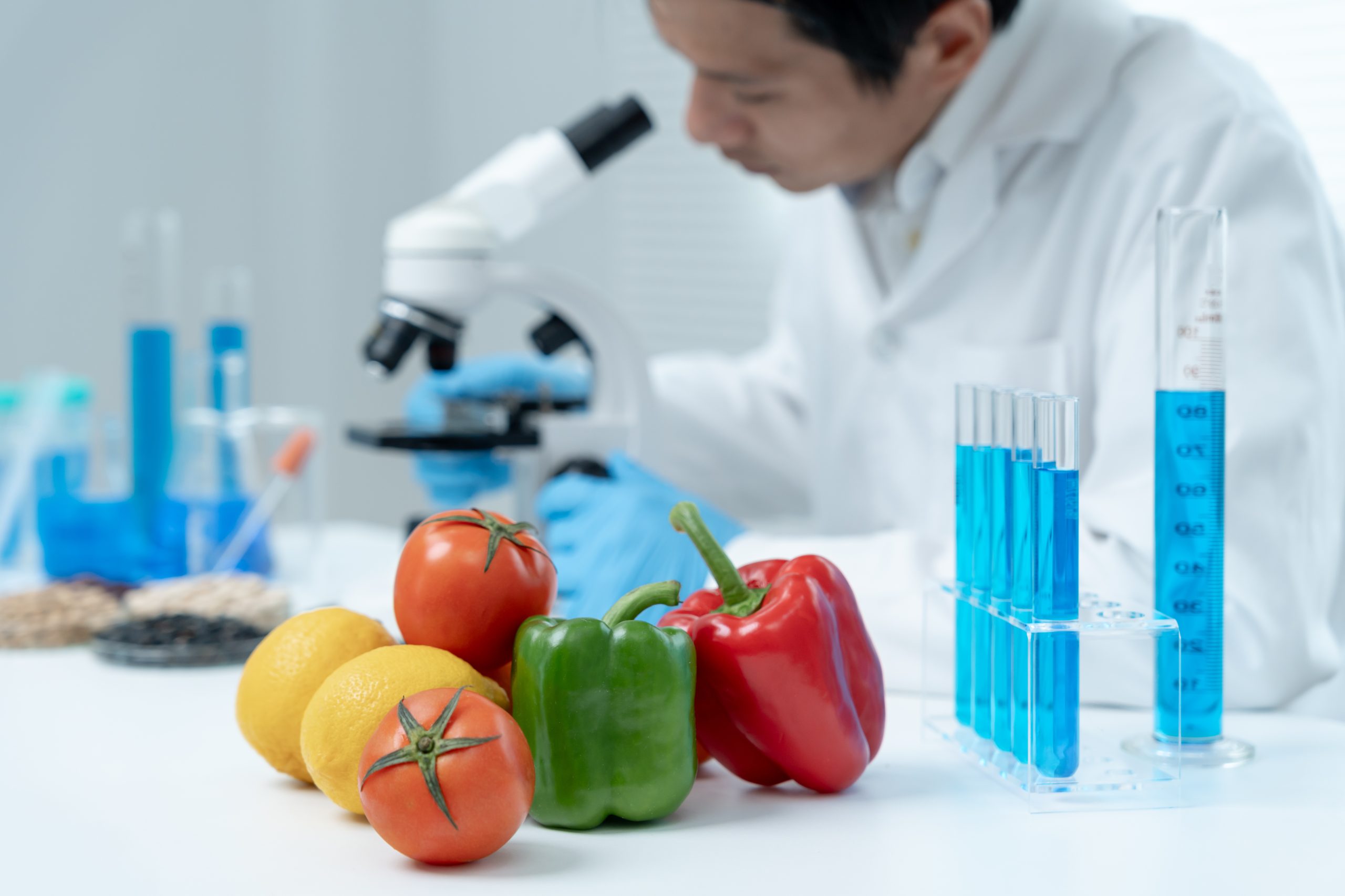 Scientist check chemical food residues in laboratory. Control experts inspect quality of fruits, vegetables. lab, hazards, ROHs, find prohibited substances, contaminate, Microscope, Microbiologist