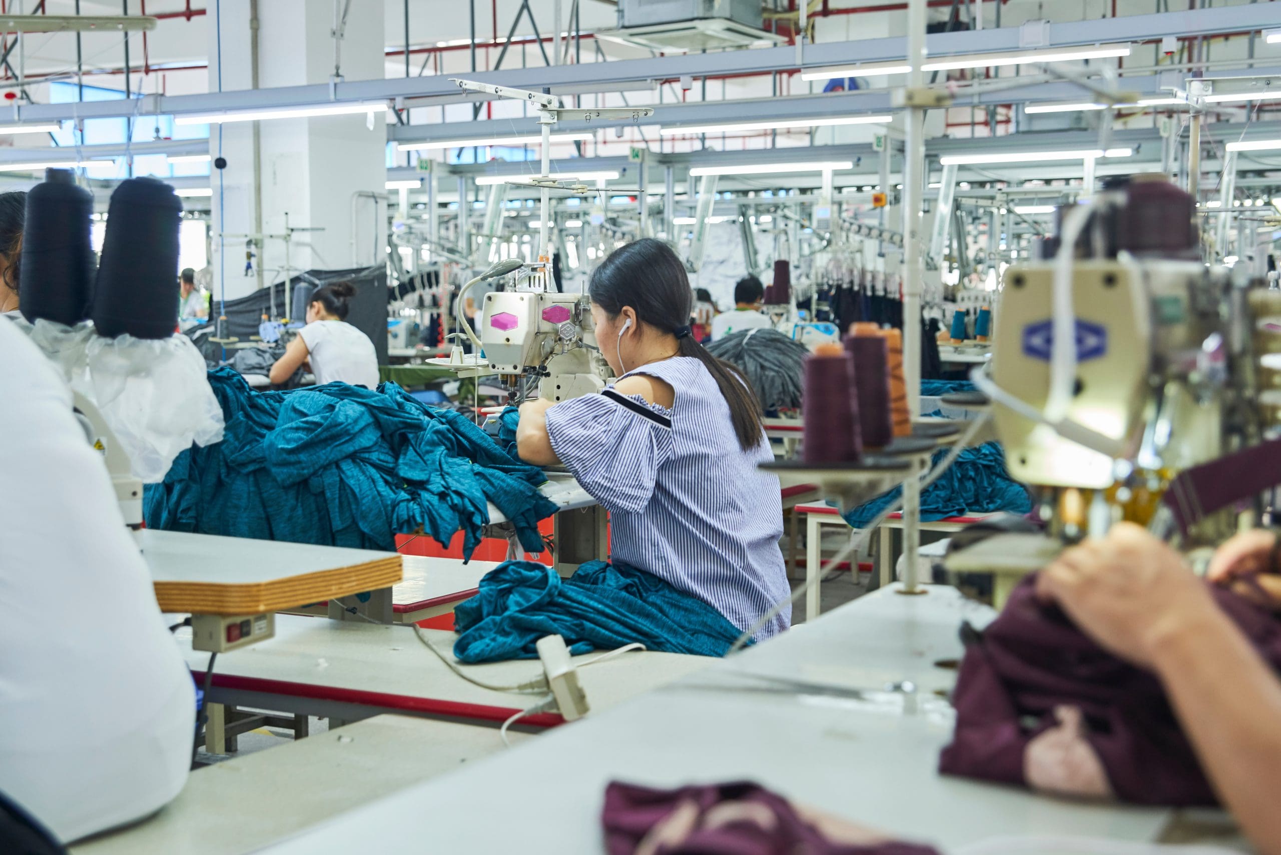 Employee’s working with their sewing machines in clothing factor